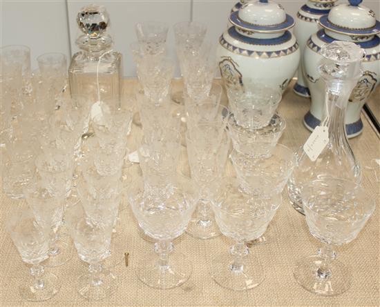 An Edinburgh crystal sixty three piece suite of drinking glasses and a matching decanter and stopper, 20th century